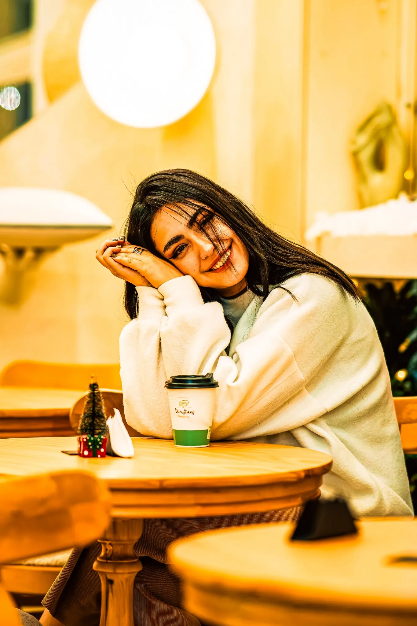 Warm golden hour preset applied to an indoor coffee shop, causing a heavy yellow color cast